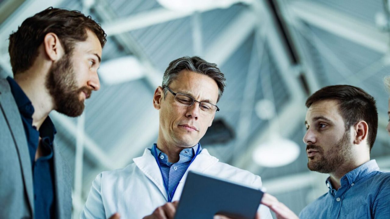 three doctors reviewing information together